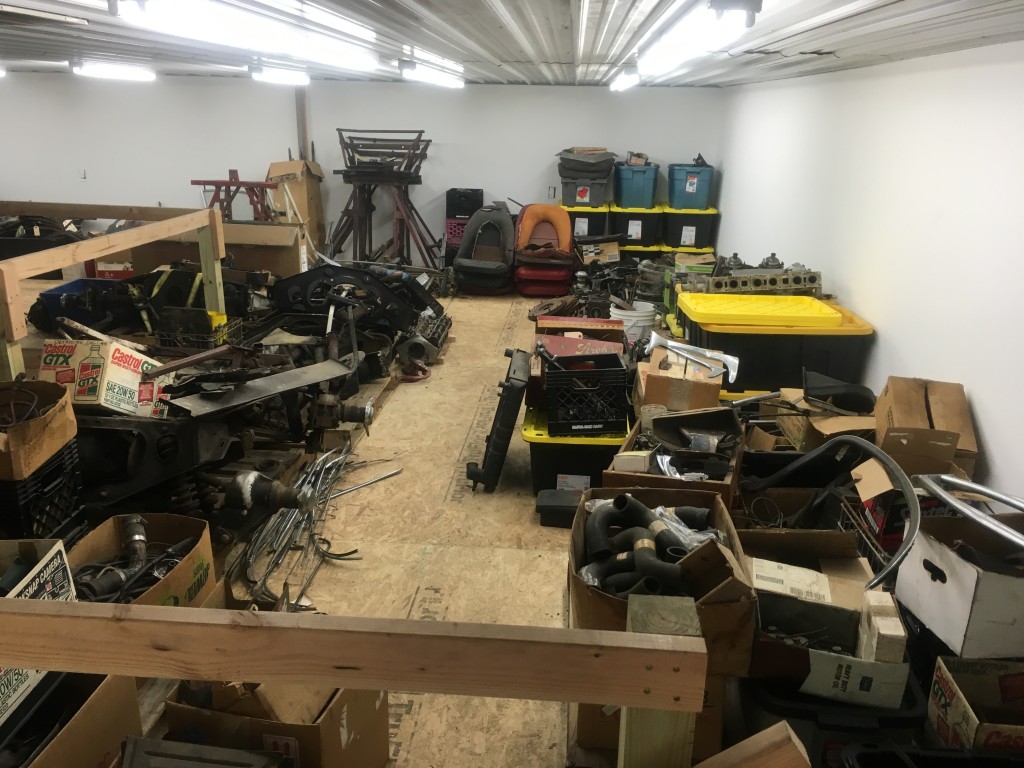 This is not a very "glorious" shot of the projects in their current state, but shows the mezzanine of the new shop, which we specifically built for the purpose of storing these parts. This shot shows about half of the mezzanine - 6 to 8 E-Types disassembled takes up ALOT of space! In the coming weeks and months, we will be setting up a new rack system on the other side of the new shop and beginning to divide this treasure into separate piles of parts - each representing one E-Type.